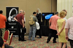 Ron Meyerowitz showing a dealer around the show