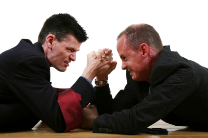 Photo of two businessmen arm wrestling