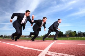 Photo of businessmen on a racetrack