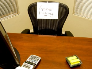 Photo of office with Gone Fishing sign