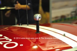 Close-up shot of the IC720 camera mounted atop a race car.