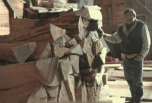 Photo of Tom Thiel selecting wood