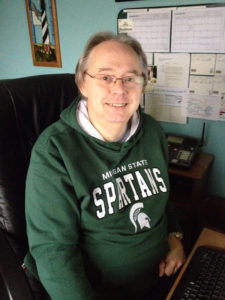 Photo of Ted Green in Spartan sweatshirt