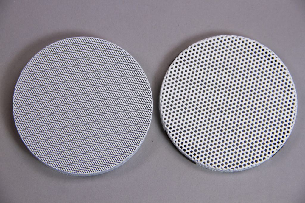 Photo showing a comparison of new James Loudspeaker Microperf speaker grille versus their original grille design