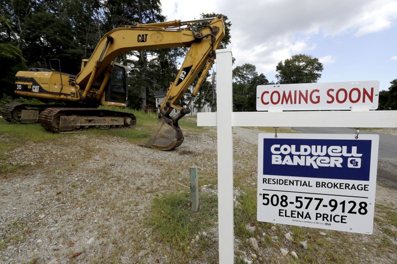 a machine gets ready to start constructing a housing project