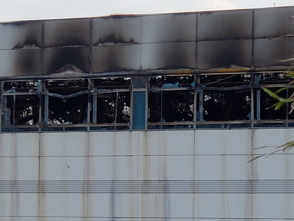 A closeup photo showing the damage to the AKM factory from the fire