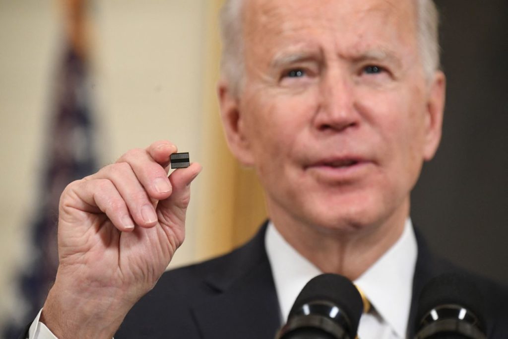 President Biden holds an IC chip, a major supply chain issue as demand caused shortages