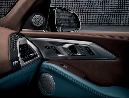 An interior shot of the BMW XM showing the B&W tweeter and midrange in the door
