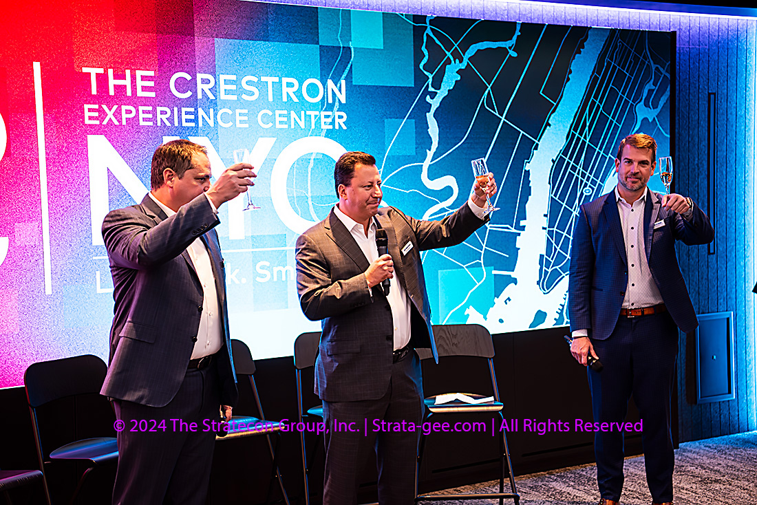 Crestron executives John Clancy, Dan Feldstein, and Brad Hintze toast the new Experience Center in NYC