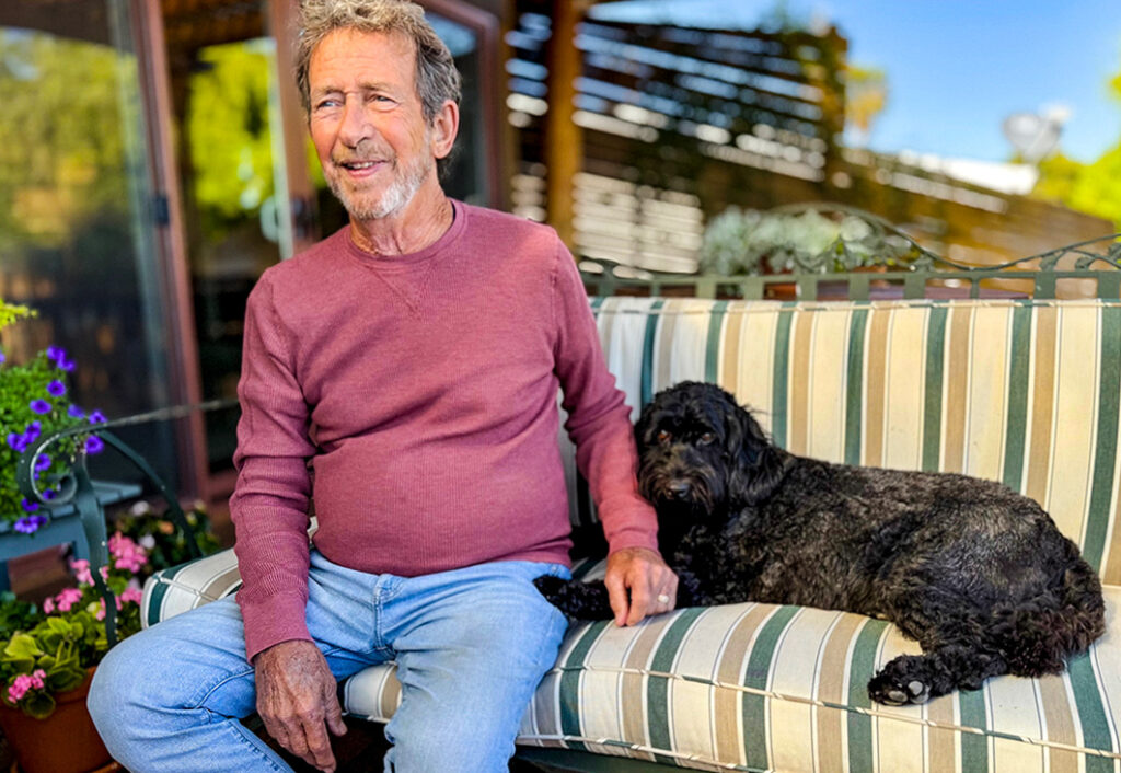 Chris Byrne relaxing with a furry family member