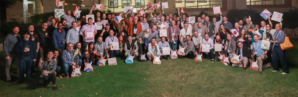 Group photo from a previous Emerald Total Tech Summit